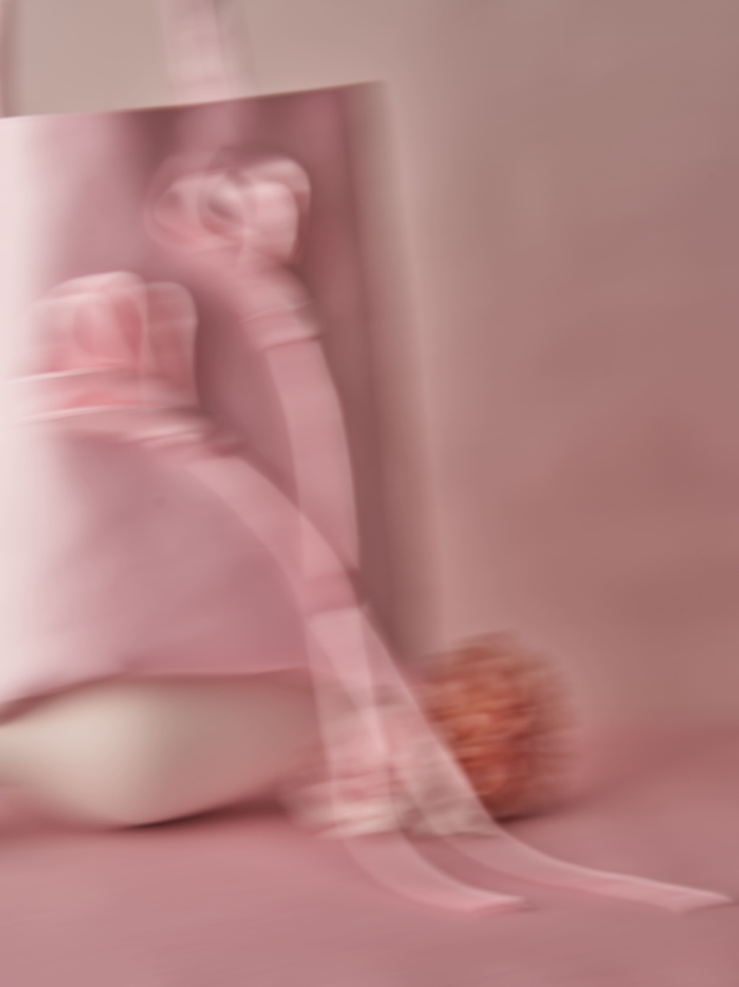 Blush satin tote in motion blur