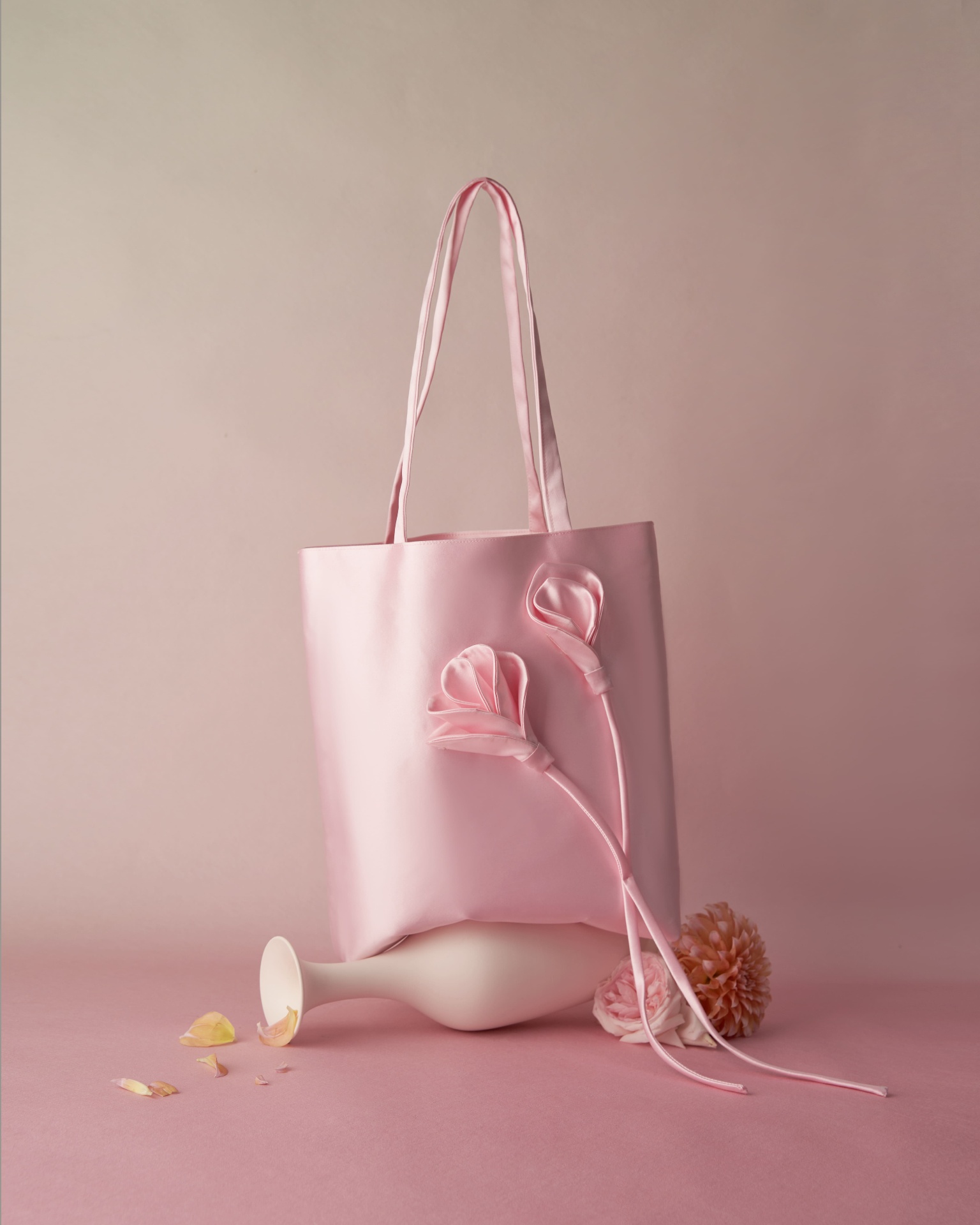 BBold blush satin tote on rose backdrop